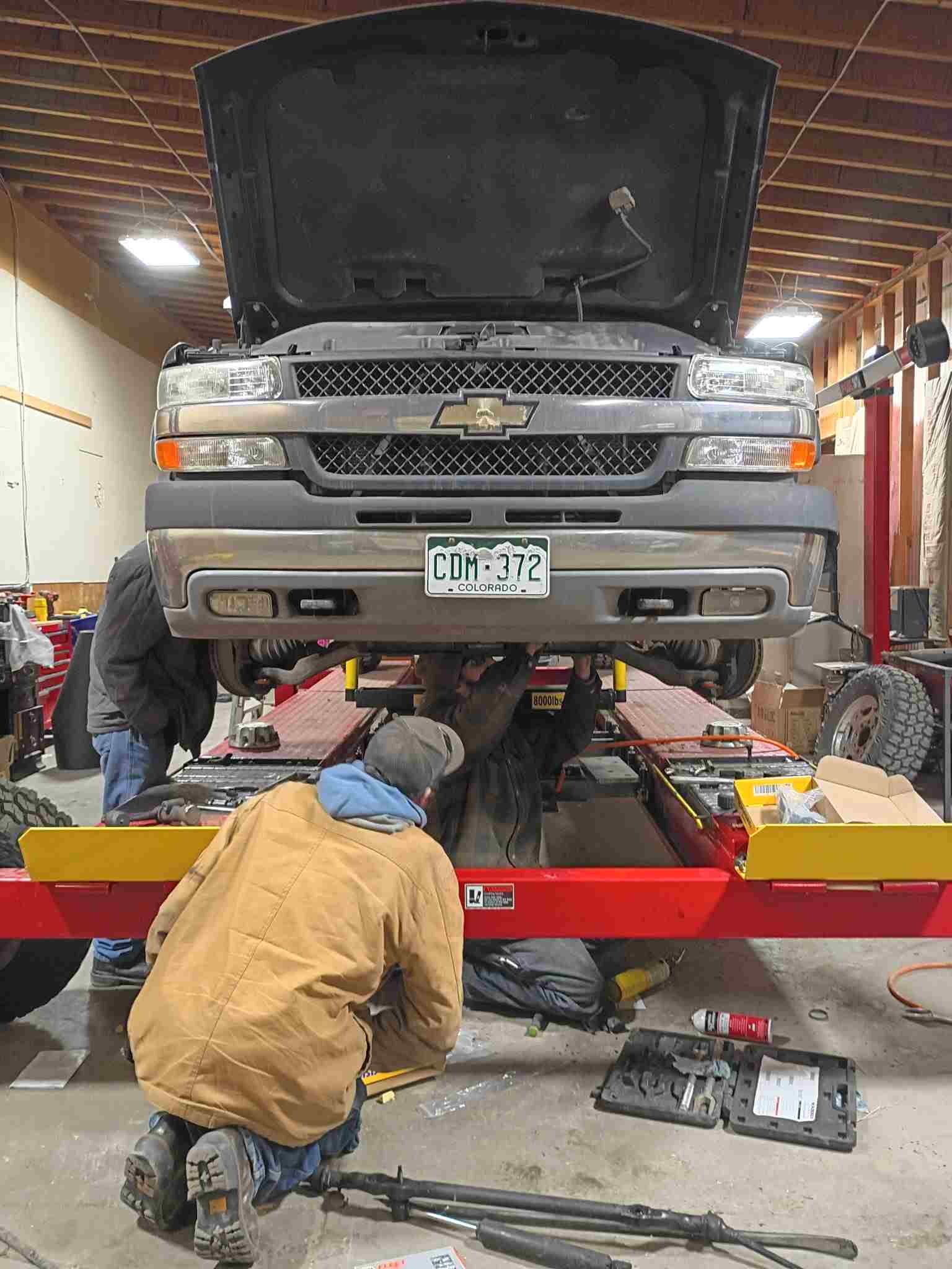 Truck on lift in Trujillo's Tire Services shop